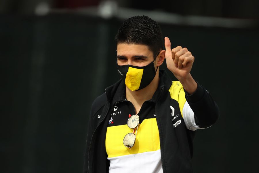 Esteban Ocon gives a thumbs up in the Paddock