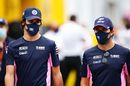 Lance Stroll and Sergio Perez walks in the Paddock