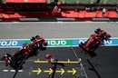 Charles Leclerc and Sebastian Vettel leave the garage