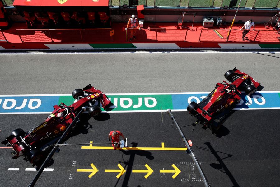 Charles Leclerc and Sebastian Vettel leave the garage