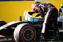 Kevin Magnussen climbs out of his car after a collision