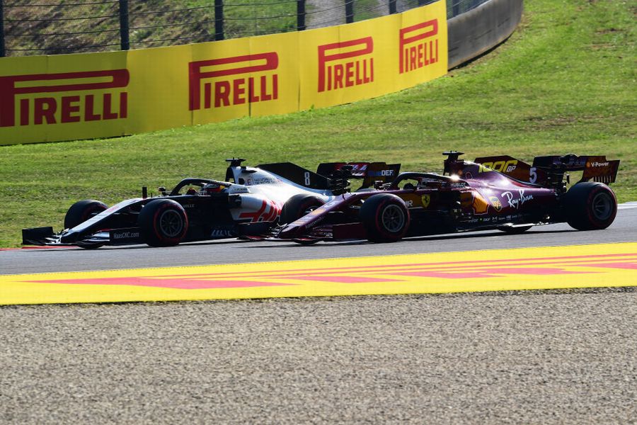 Romain Grosjean and Sebastian Vettel battle for position