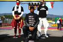 Lewis Hamilton wears a t-shirt displaying the message 'say her name' above a photo of Breonna Taylor