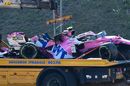 The car of Lance Stroll is seen on a tow truck following a crash