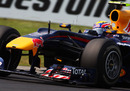 Mark Webber corners hard in the Red Bull