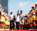 Mark Webber leads the drivers out for the pre-race parade