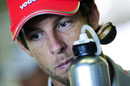 Jenson Button takes on liquid before Sunday's race