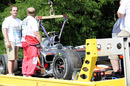Lewis Hamilton's stricken car is towed away
