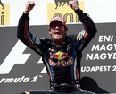 A delighted Mark Webber celebrates victory on the podium