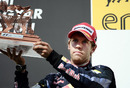 A disappointed Sebastian Vettel with his trophy for third place