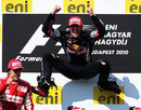 A delighted Mark Webber jumps for joy