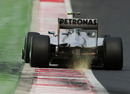 Nico Rosberg rides the kerb on the exit