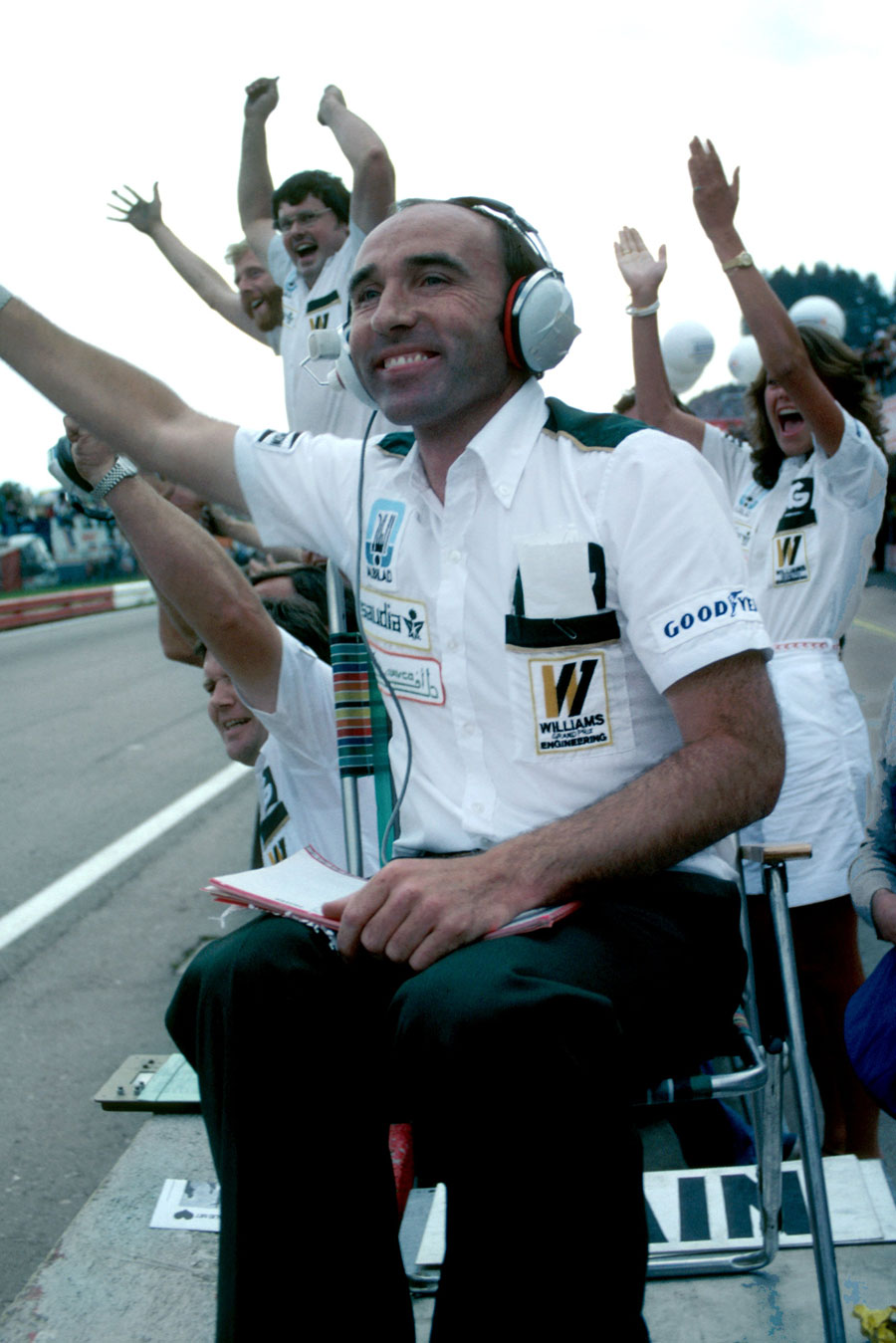 Frank Williams celebrates Alan Jones's second consecutive victory and the third in a row for his Williams team