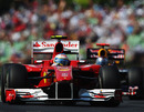 Fernando Alonso in the Ferrari leads Sebastian Vettel's Red Bull
