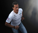 Michael Schumacher heads back to the paddock after a drivers' meeting