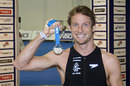 Jenson Button with his medal after completing  the London Triathlon
