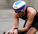 Jenson Button swapped four wheels for two during the London Triathlon