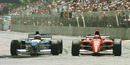 Gerhard Berger goes wheel to wheel with Michael Schumacher