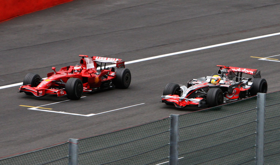 Lewis Hamilton overtakes Kimi Raikkonen after letting the Ferrari past