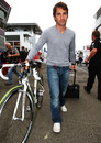 Timo Glock arrives in the paddock with his bike and suitcase in tow