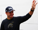 Rubens Barrichello waves to fans