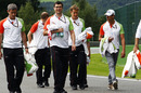Adrian Sutil walks the track with his team