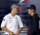 Michael Schumacher and Sebastian Vettel share a joke during Thursday's press conference