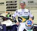 Rubens Barrichello poses with his commemorative 300th grand prix helmet