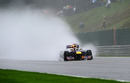 Spray flies from Sebastian Vettel's Red Bull
