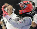 Michael Schumacher tries his gloves out for size