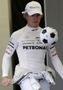 Nico Rosberg passes time in the Mercedes garage