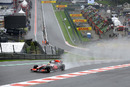 Lewis Hamilton negotiates Eau Rouge in the wet