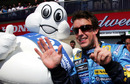Fernando Alonso celebrates his sixth win of the season with the Michelin man
