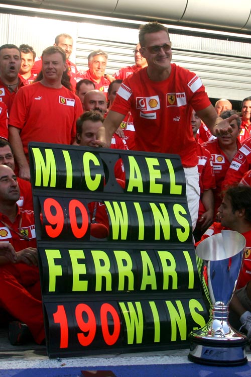 Michael Schumacher celebrates his win 90th win