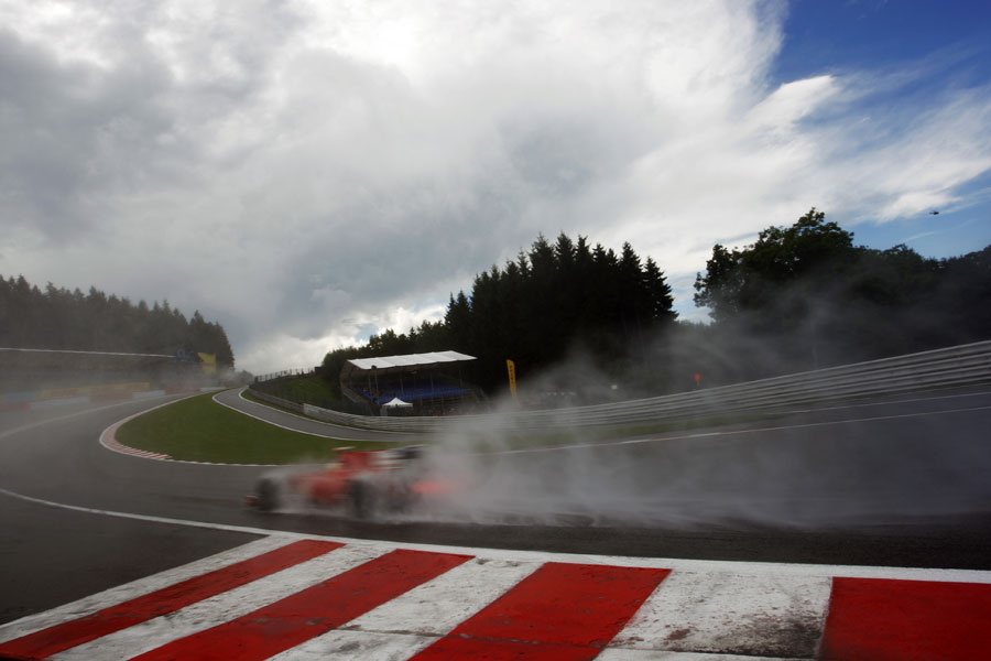 Felipe Massa splashes through Eau Rouge
