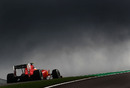 Dark rain clouds loom above Fernando Alonso