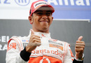 Lewis Hamilton shows his delight at winning his first Belgian Grand Prix