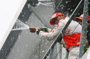 Lewis Hamilton sprays champagne after winning his first Belgian Grand Prix