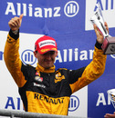 Robert Kubica celebrates his third-place finish
