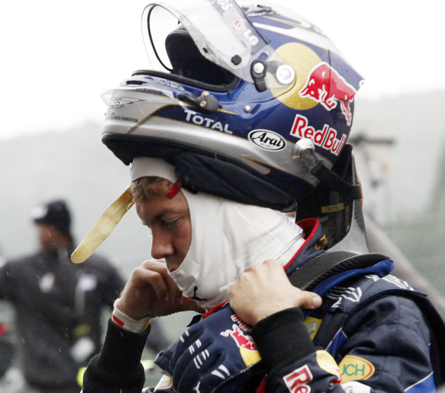 Sebastian Vettel takes off his helmet at the end of a forgettable afternoon for him 