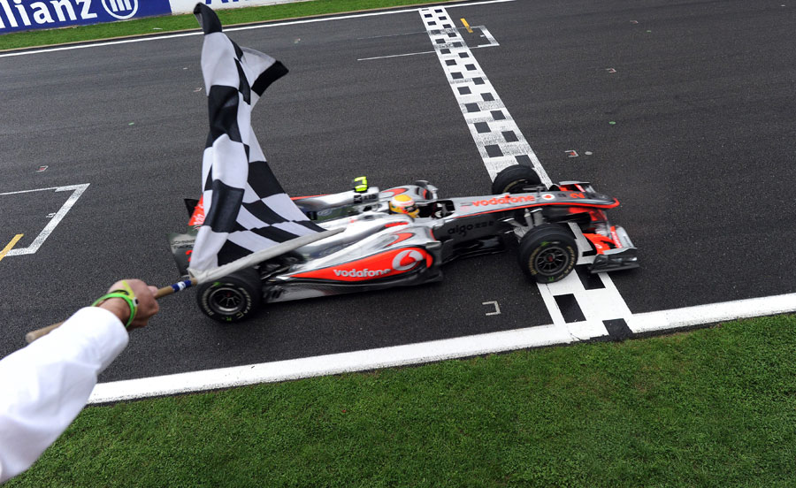 Lewis Hamilton takes the chequered flag for victory