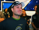 An emotional Rubens Barrichello watches a tribute to his career at his 300th grand prix