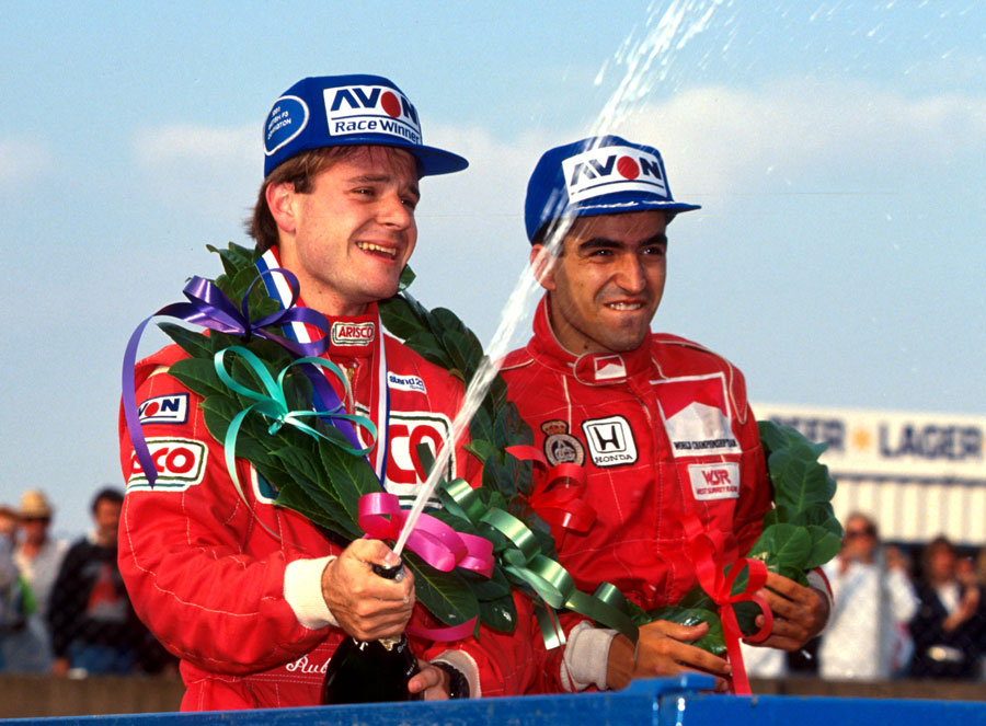 Rubens Barrichello celebrates victory alongside Jordi Gene
