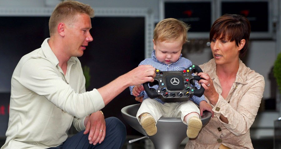 Former World Champion Mika Hakkinen with his son Hugo and wife Erja