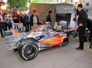 A McLaren MP4-23 is moved from the street to the Waldorf Hilton Hotel  for the Formula 100 presentation