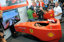 Fernando Alonso and Felipe Massa demonstrate a Ferrari simulation at Monza