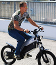 Michael Schumacher rides his bike around Monza on Thursday