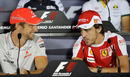 Jenson Button chats to Fernando Alonso during Thursday's press conference