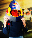 Sebastian Vettel tries on a speed skiing helmet for size
