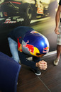 Sebastian Vettel assumes the tuck position whilst wearing a speed skier's helmet